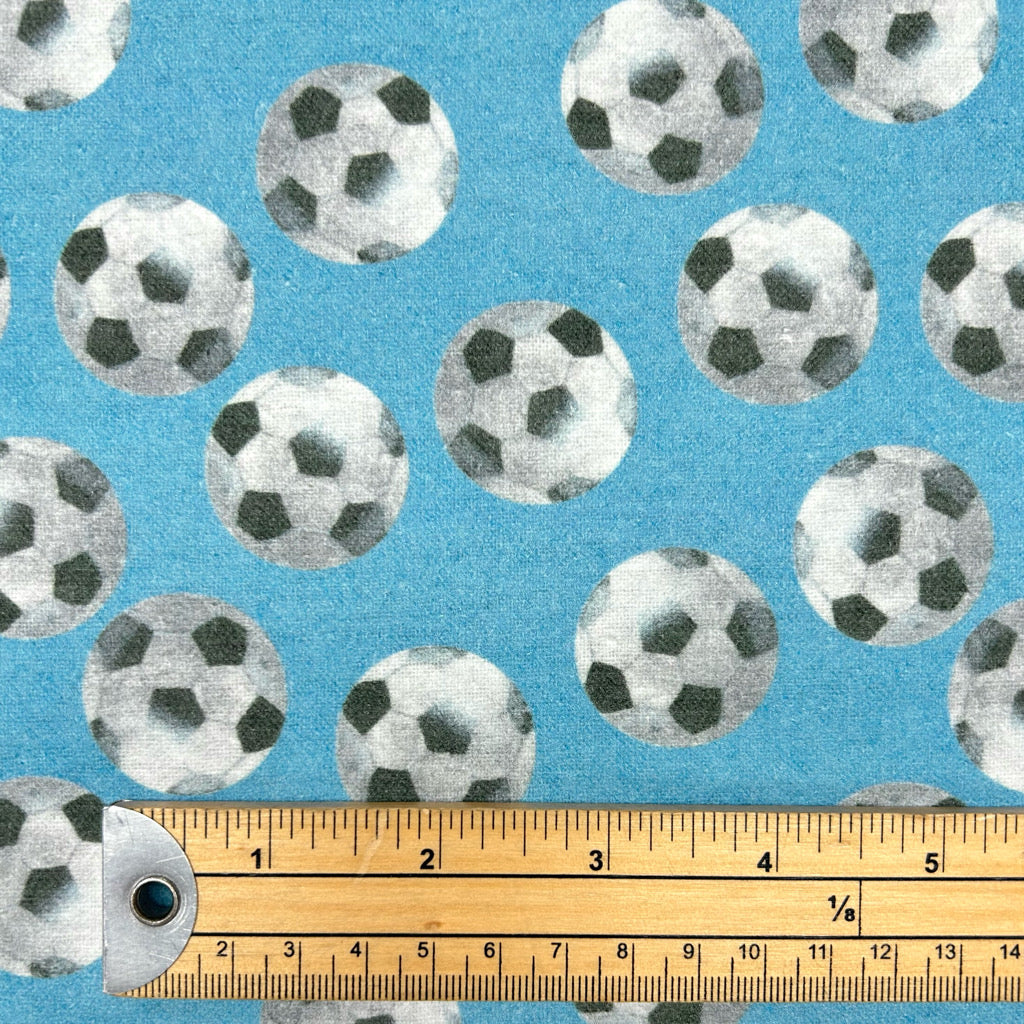 Footballs on Blue Brushed Cotton Fabric - Little Johnny