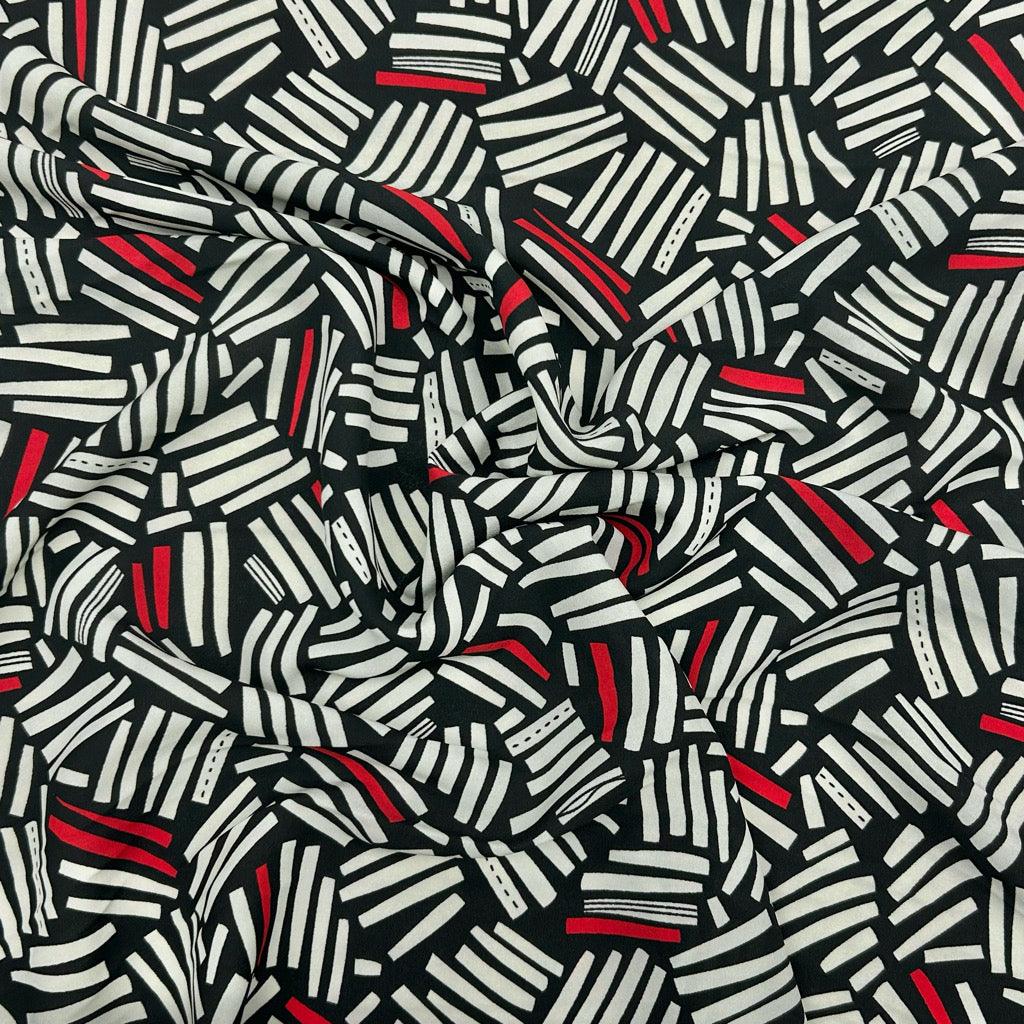 Cream and Red Lines on Black Crepe Fabric - Pound Fabrics