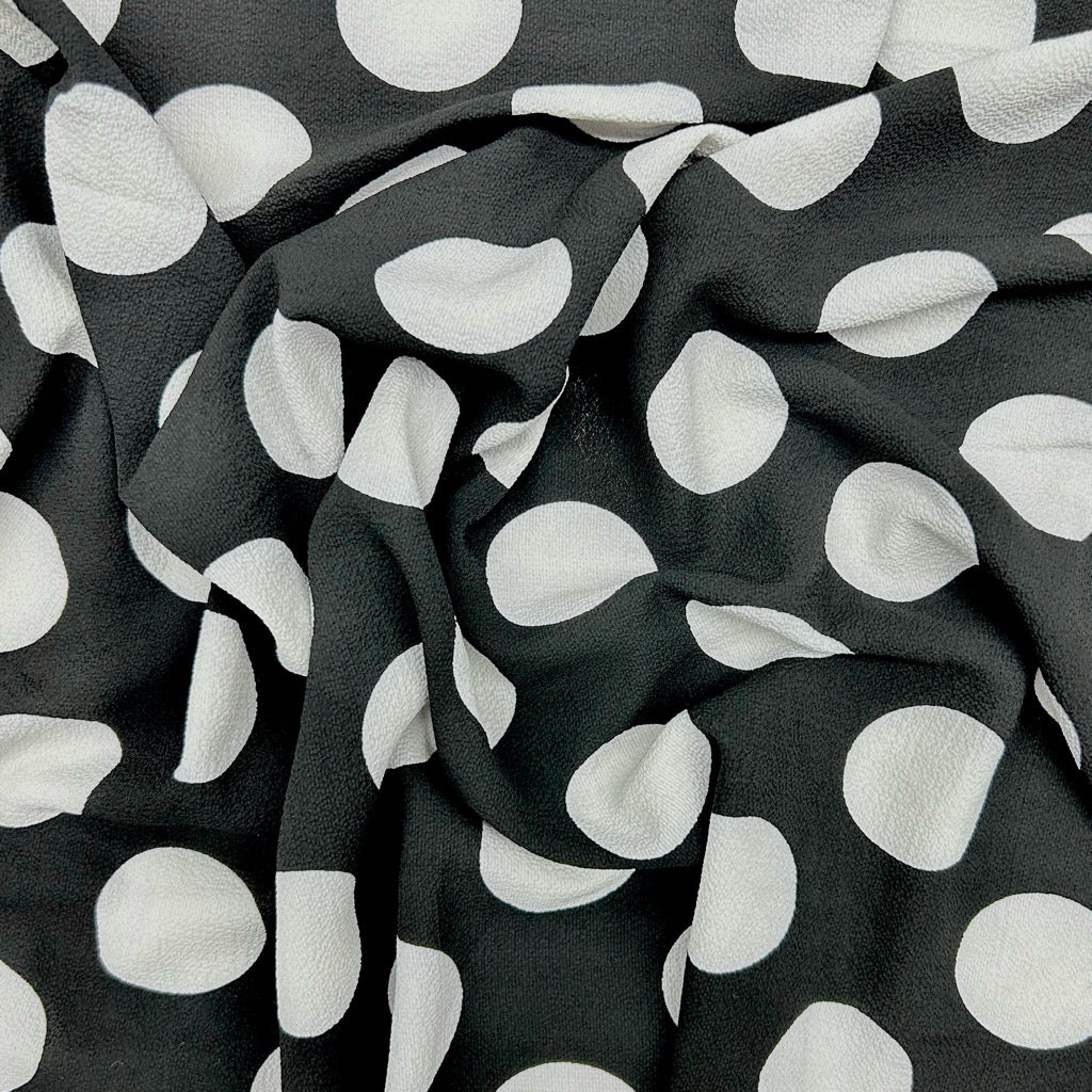 White Spots on Black Polyester Crepe Fabric