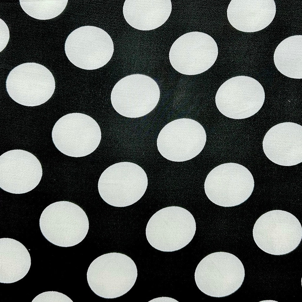 White Spots on Black Polyester Crepe Fabric