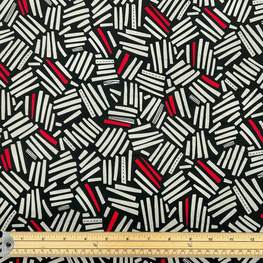 Cream and Red Lines on Black Crepe Fabric - Pound Fabrics