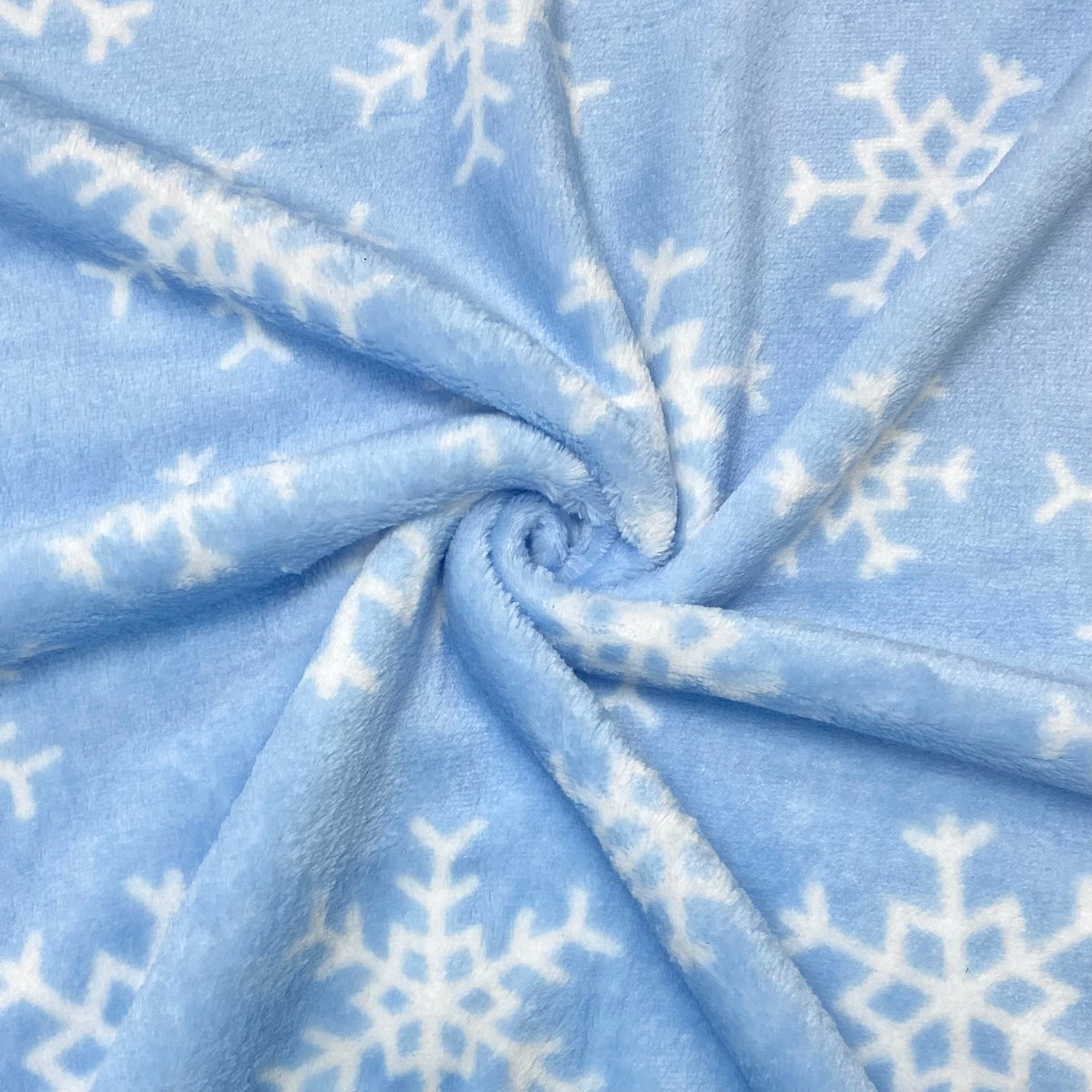 Snowflakes on Blue Cuddle Fleece Fabric - Pound Fabrics