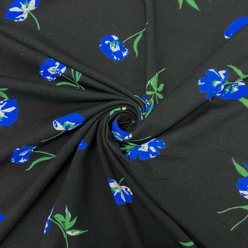Blue Flowers on Black Cotton Jersey Fabric - Pound Fabrics