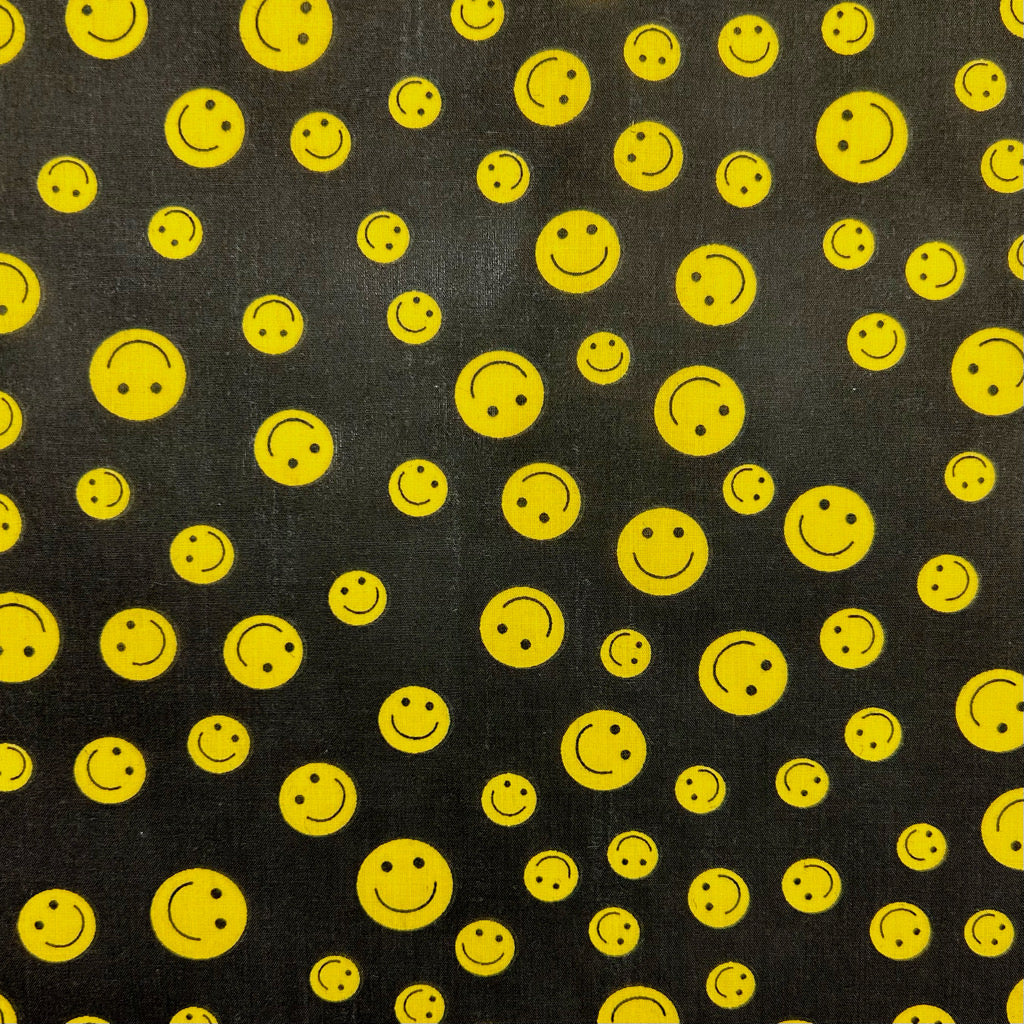 Yellow and Black Smiley Face Polycotton Fabric