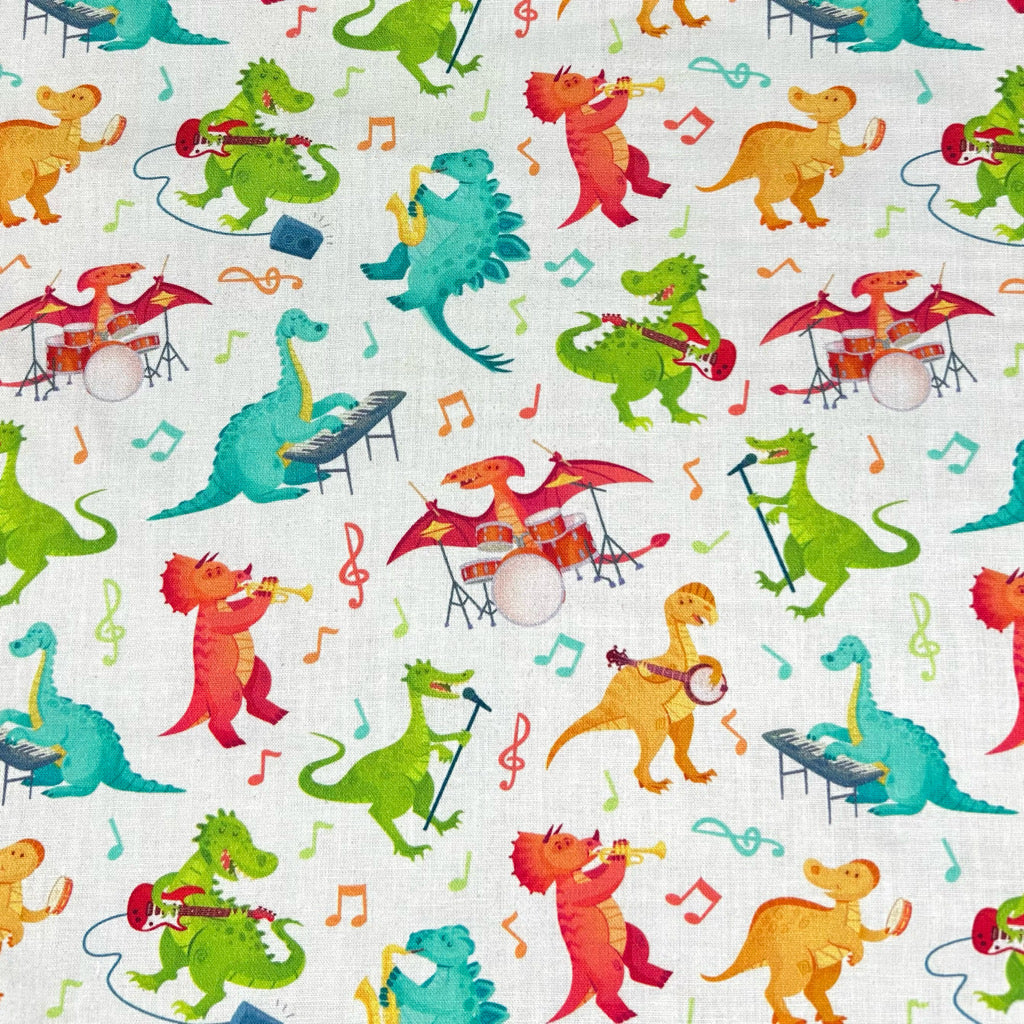 Dino Tunes on Ivory Cotton Fabric
