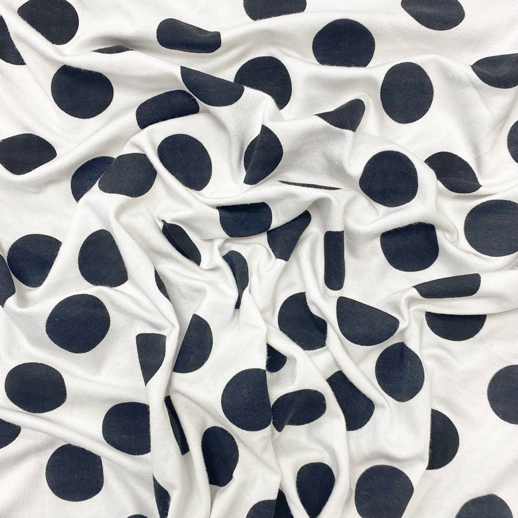 Black Spots on White Knit Fabric