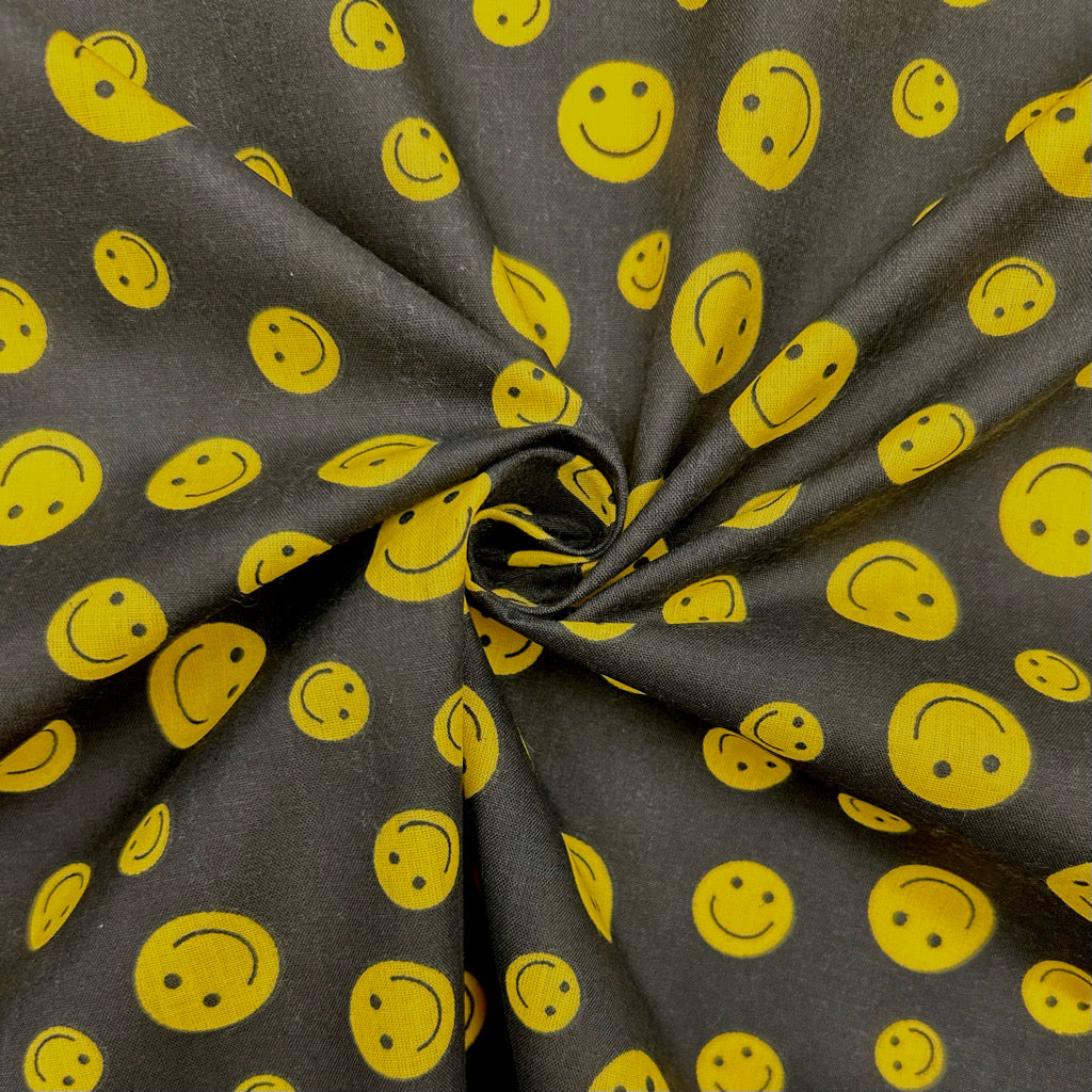 Yellow and Black Smiley Face Polycotton Fabric