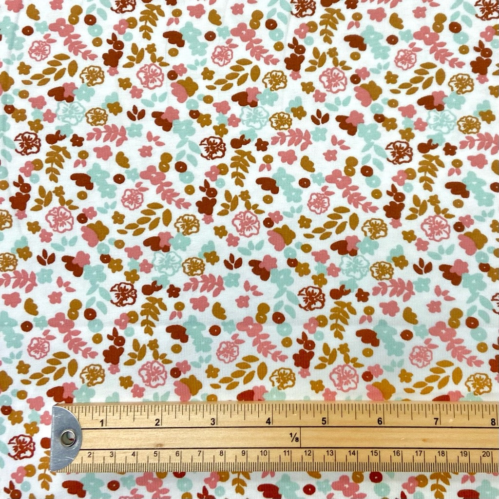 Mini Cartoon Flowers on White Cotton Jersey Fabric