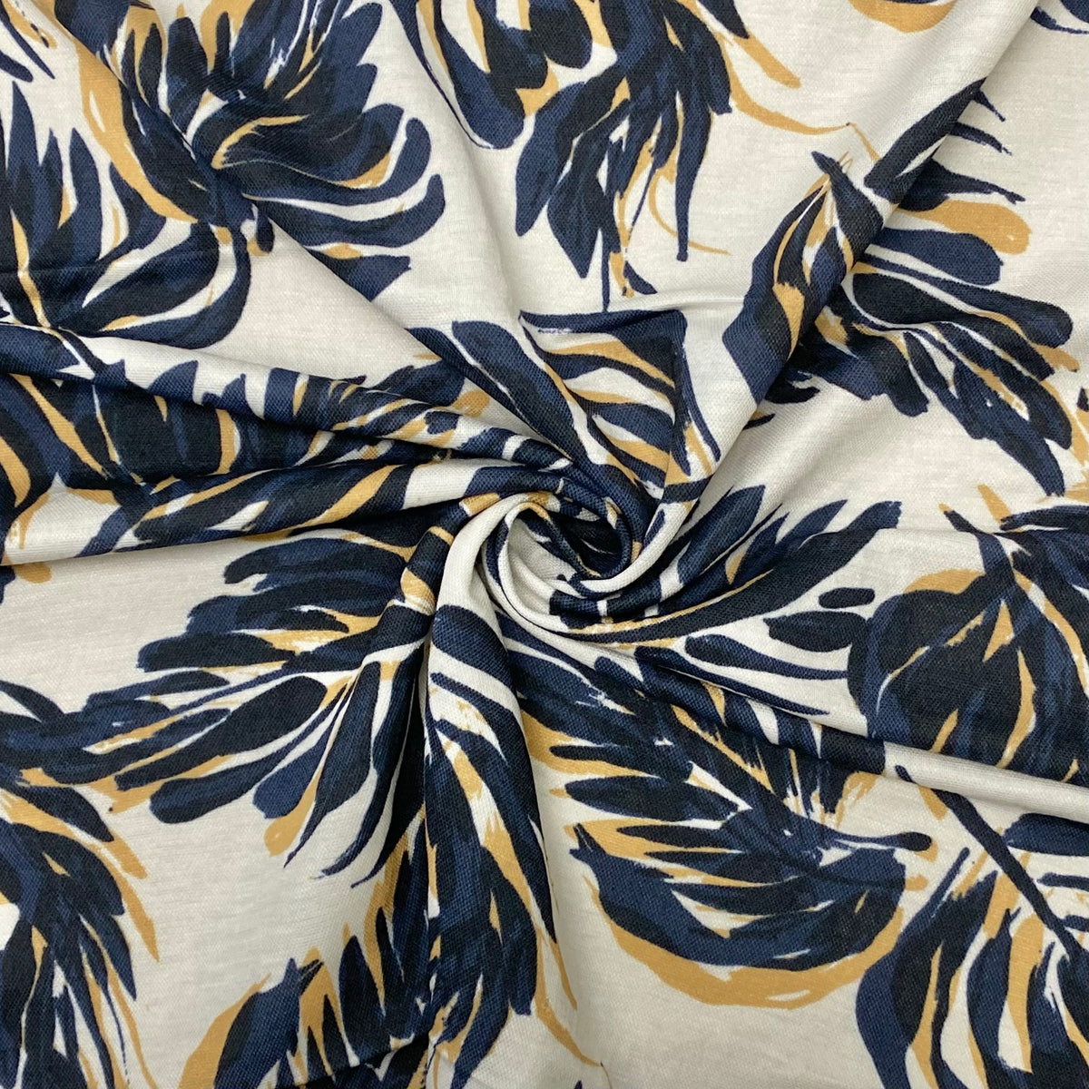 Navy Leaves on Beige PolyViscose Jersey Fabric - Pound Fabrics