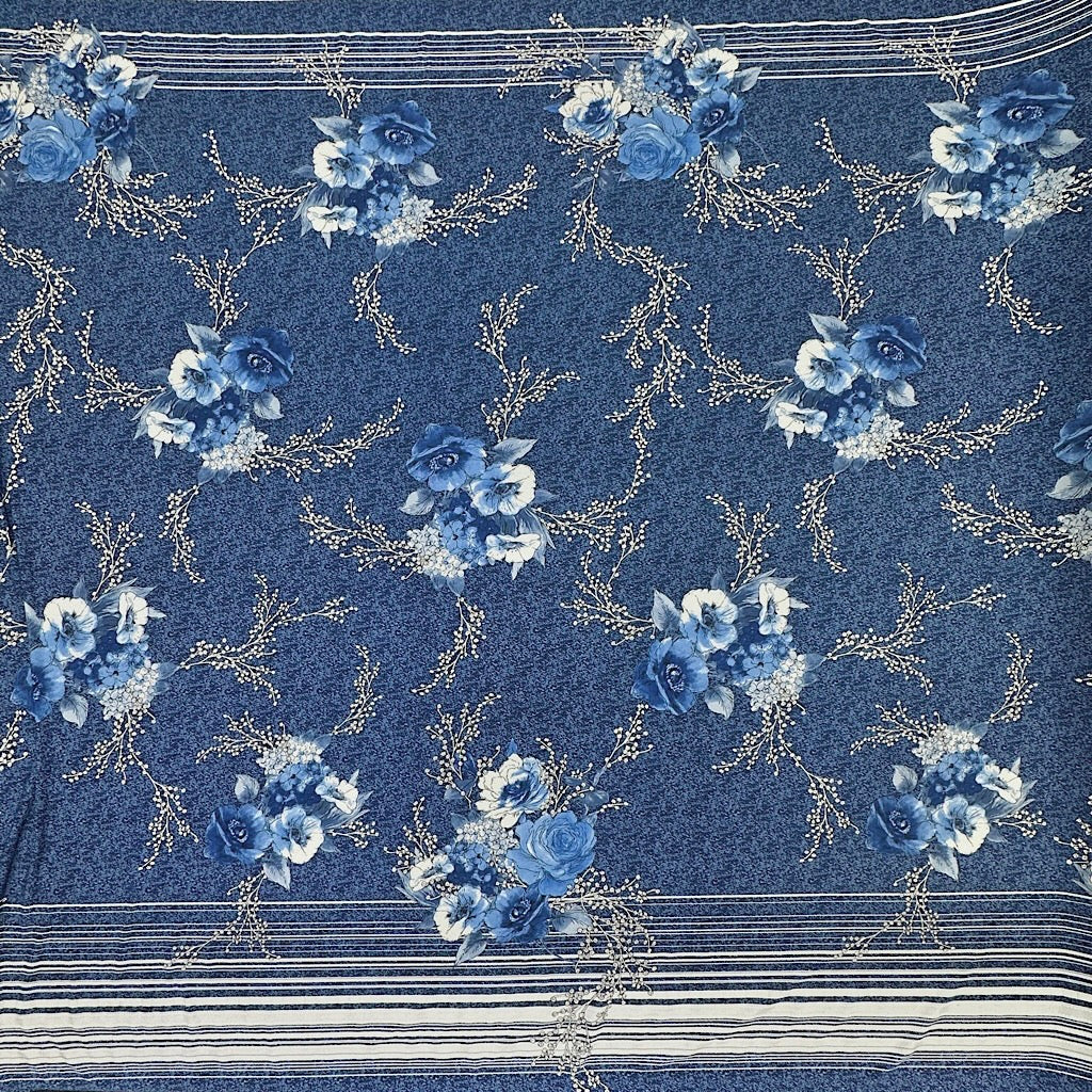 Flowers on Blue Jersey Fabric - Pound Fabrics