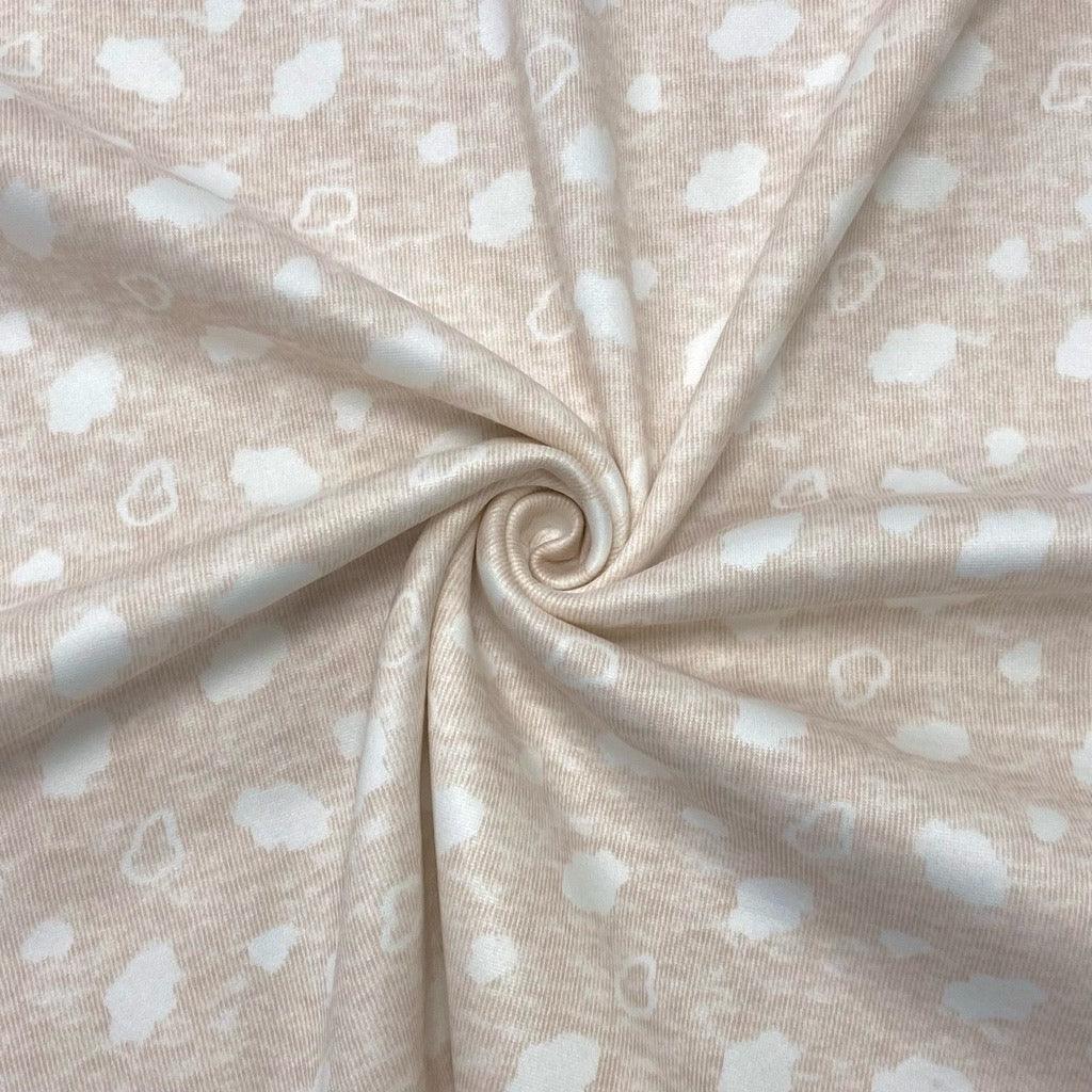 Clouds on Light Peach Fleece-Backed Jersey - 1m Pre-cut - Pound Fabrics