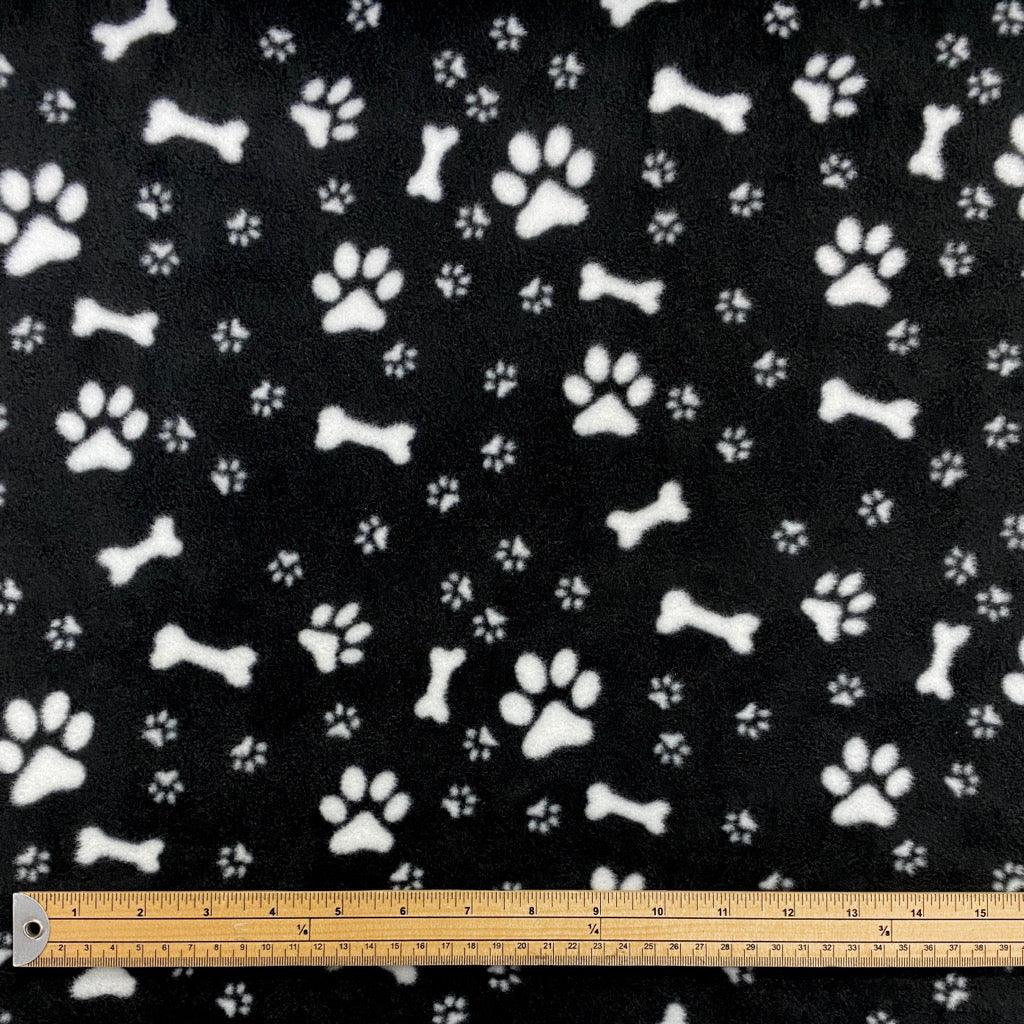 Paws and Bones on Black Anti Pill Polar Fleece Fabric - Pound Fabrics