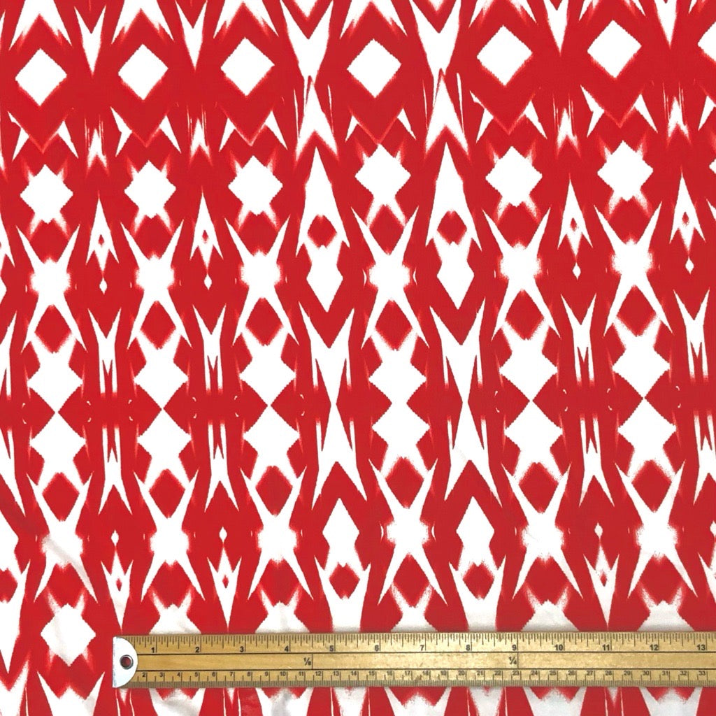 White Geometric Patterns on Red Lycra Spandex Fabric