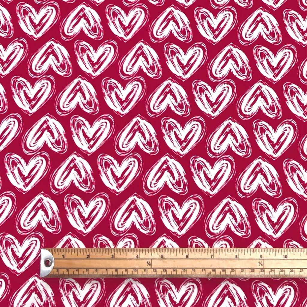 Scribbled White Hearts on Deep Red Lycra Spandex Fabric - Pound Fabrics