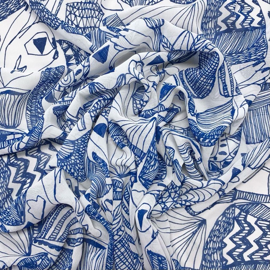 All Over Doodles on White Chiffon Fabric - Pound Fabrics