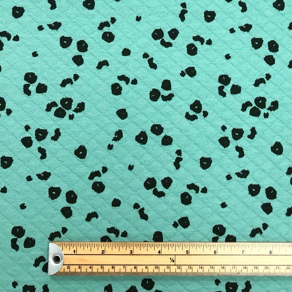 Animal Skin on Turquoise Quilted Jersey Fabric - Pound Fabrics