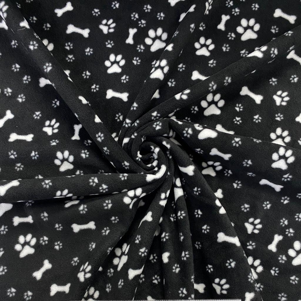 Paws and Bones on Black Anti Pill Polar Fleece Fabric - Pound Fabrics