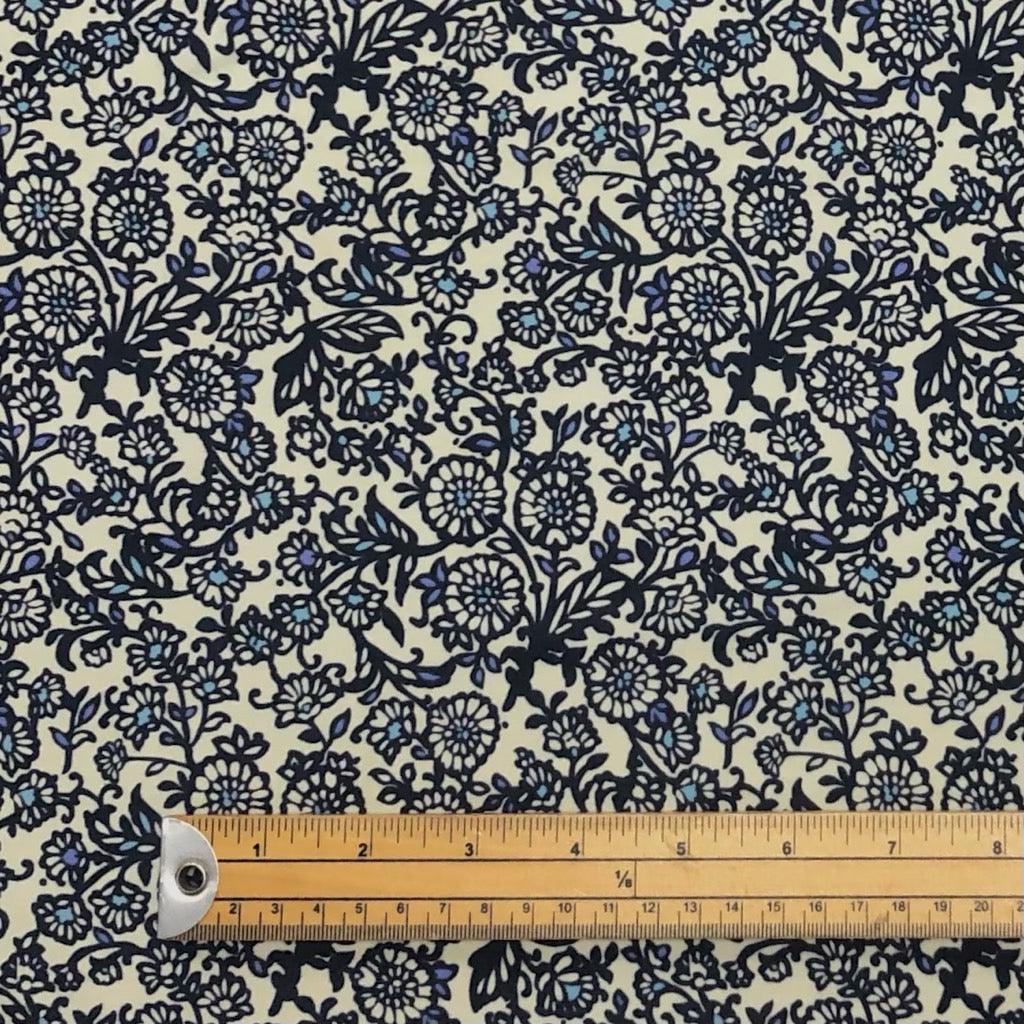 Navy Floral Patterns on Cream Lycra Spandex Fabric - Pound Fabrics
