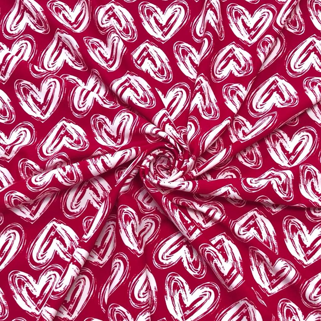 Scribbled White Hearts on Deep Red Lycra Spandex Fabric - Pound Fabrics