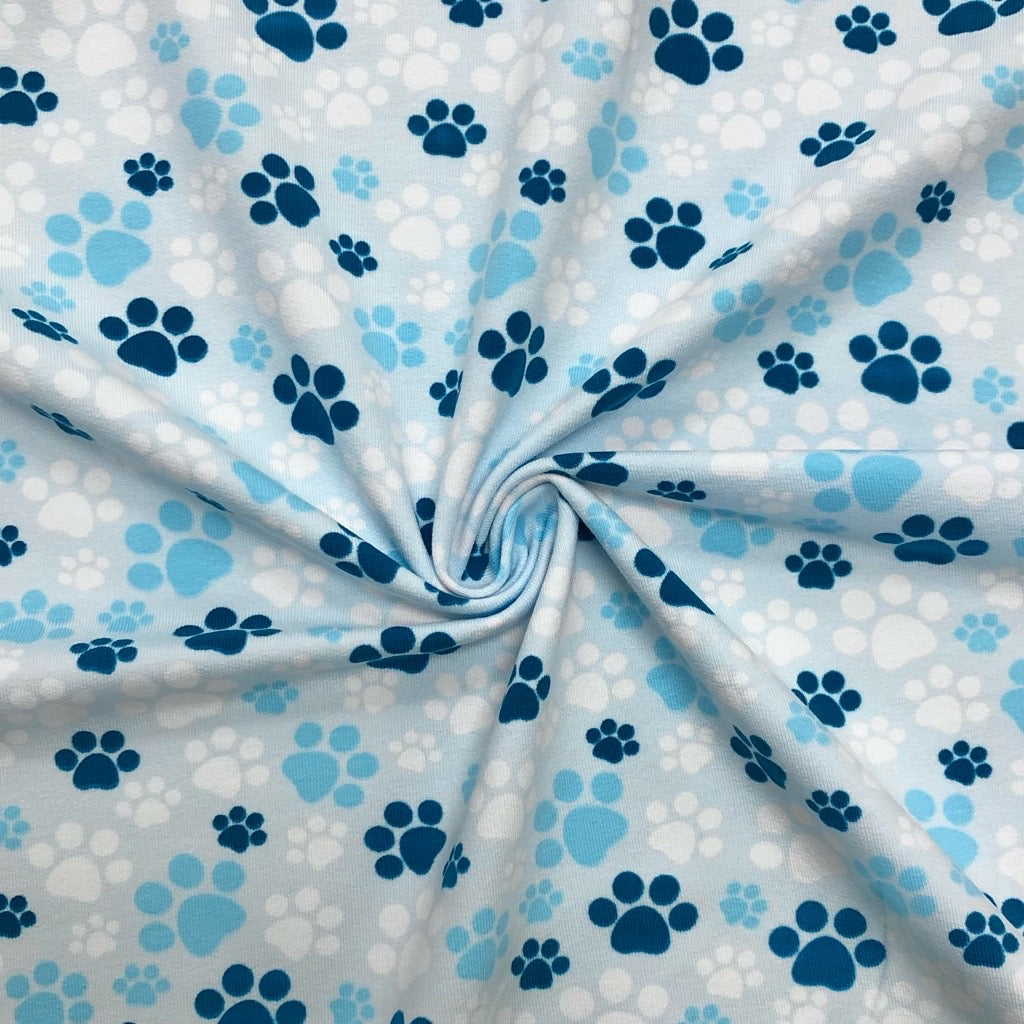 Paw Prints on Pale Blue French Terry Fabric