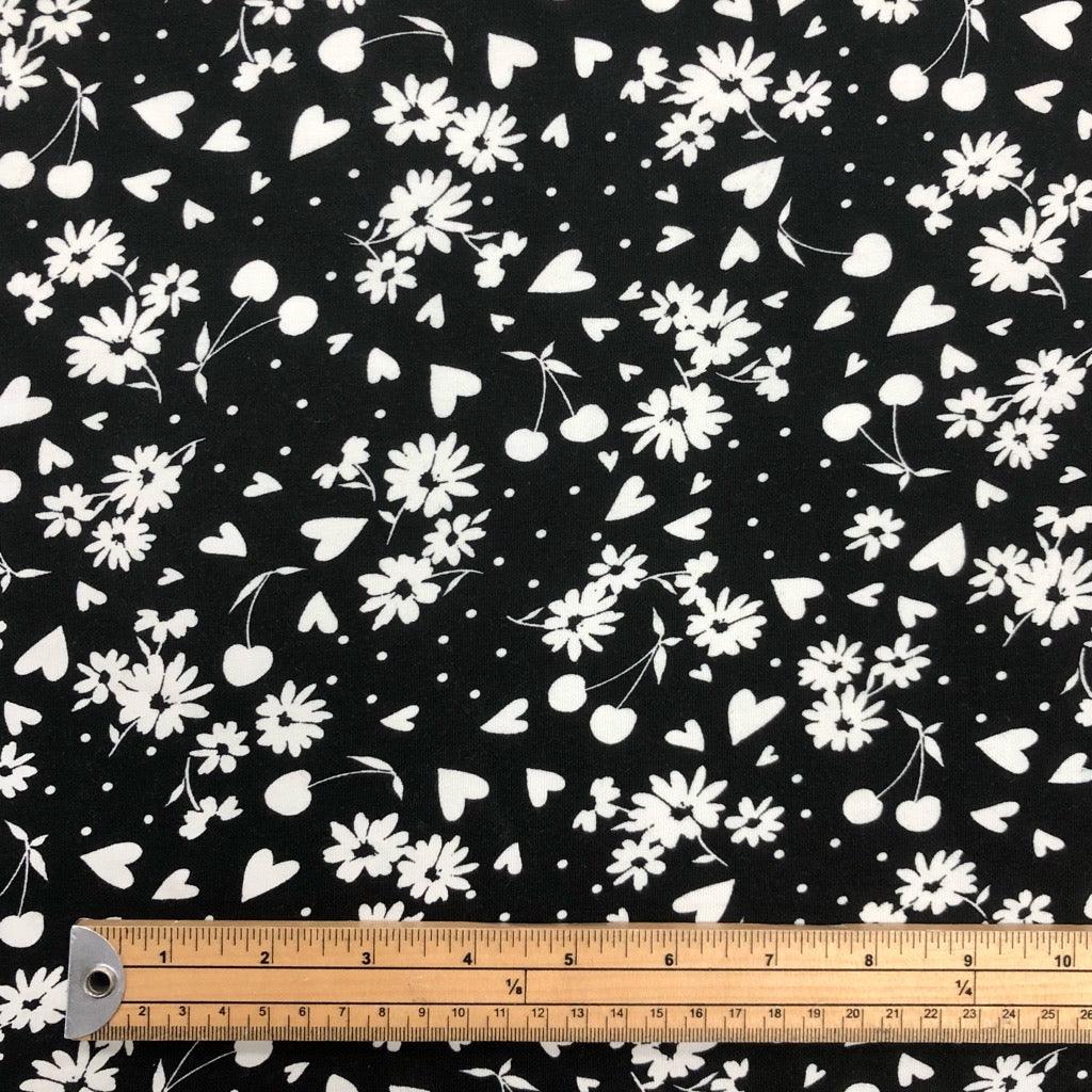 White Floral and Cherries on Black Cotton Jersey Fabric - Pound Fabrics