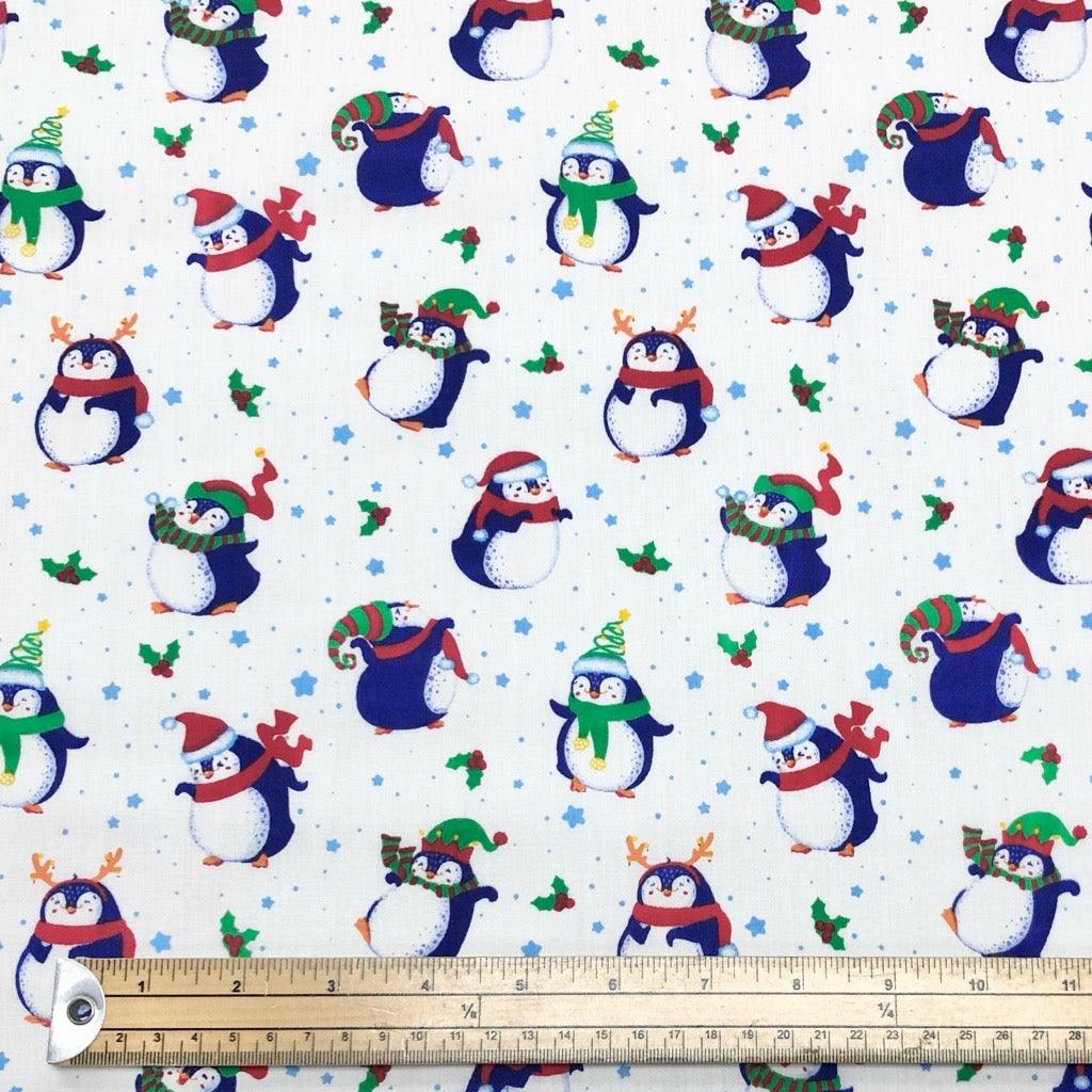 Christmas Penguins on White Polycotton Fabric - Pound Fabrics