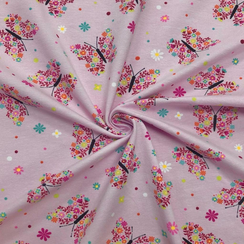 Floral Butterflies on Pink Cotton Jersey Fabric - Pound Fabrics