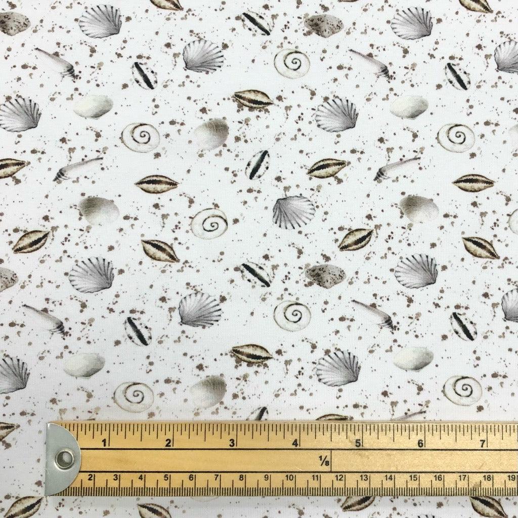 Sea Shells on White Cotton Jersey Fabric - Pound Fabrics