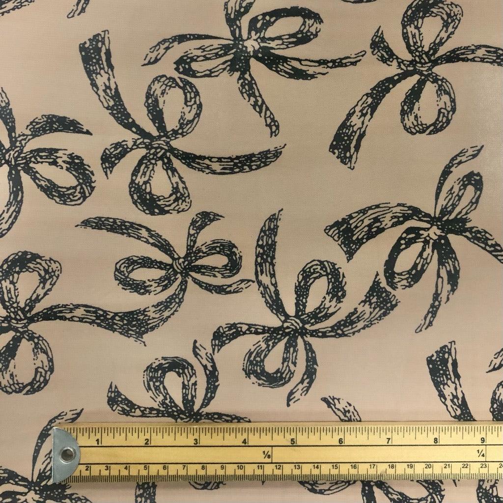 Large Black Ribbons on Beige Chiffon Fabric - 3 metres for £3 - Pound Fabrics