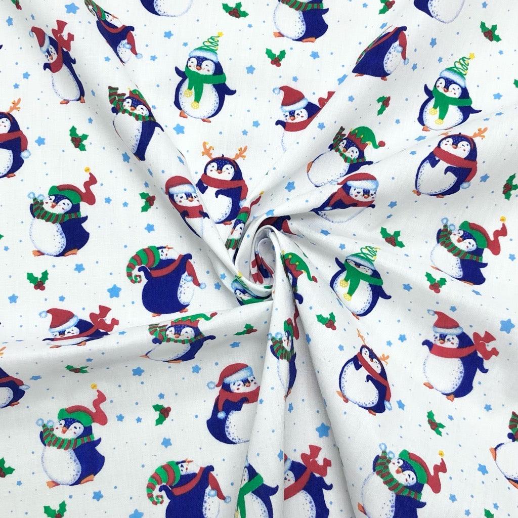Christmas Penguins on White Polycotton Fabric - Pound Fabrics