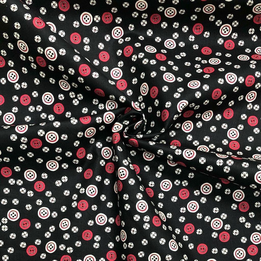 All Over Red and Beige Buttons on Black Cotton Fabric - Pound Fabrics