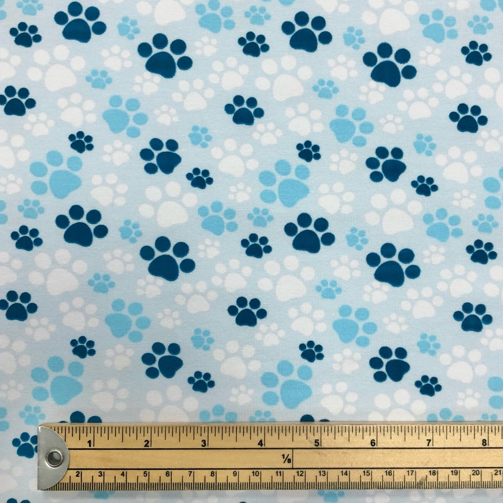 Paw Prints on Pale Blue French Terry Fabric
