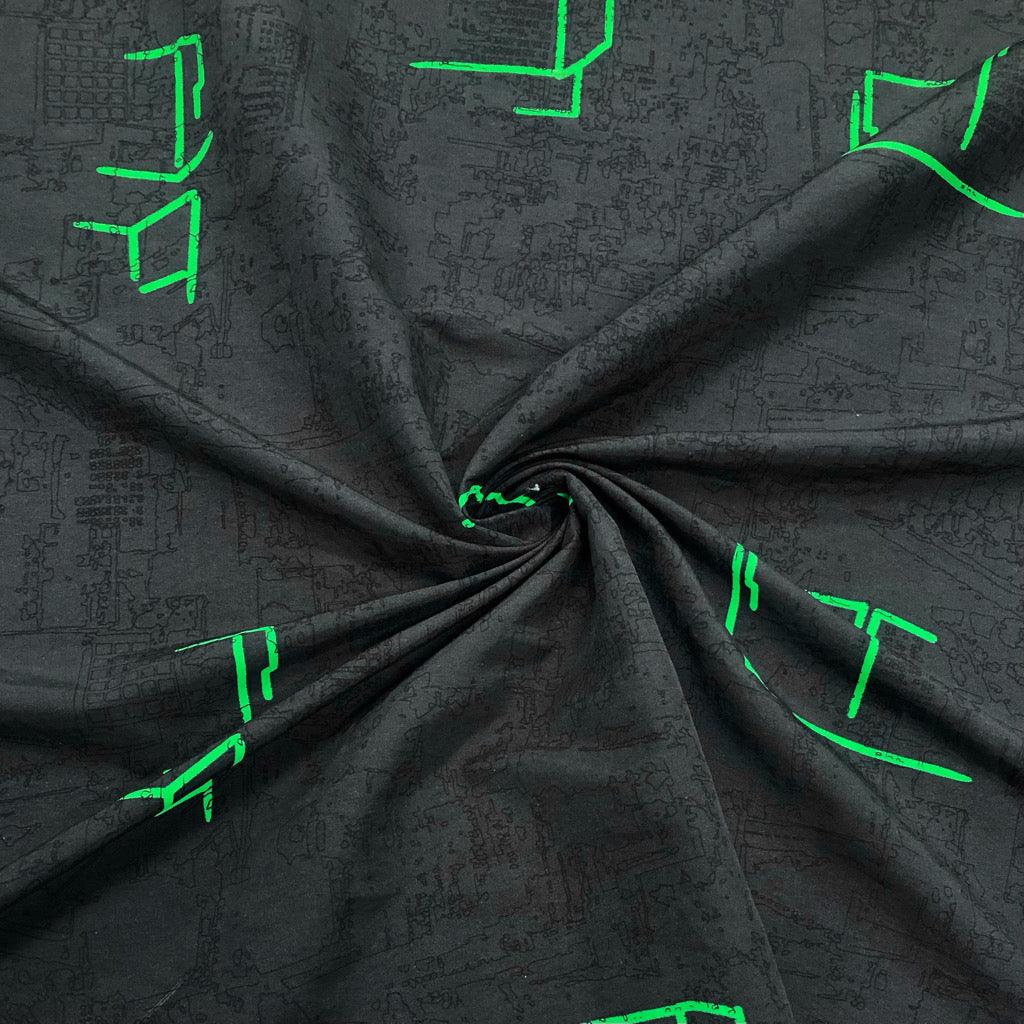 Green Patterns on Dark Grey Polyester Fabric - Pound Fabrics