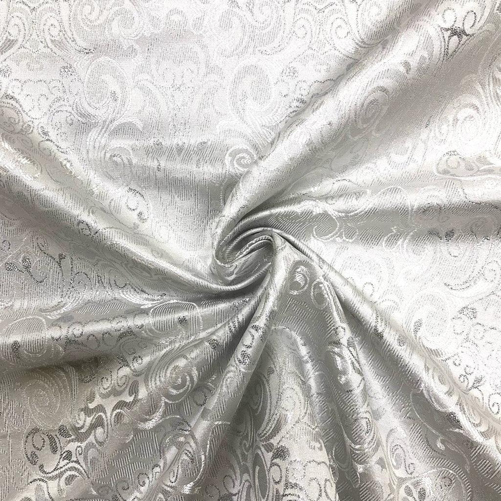 Symmetrical Patterns on Silver Brocade Fabric - Pound Fabrics