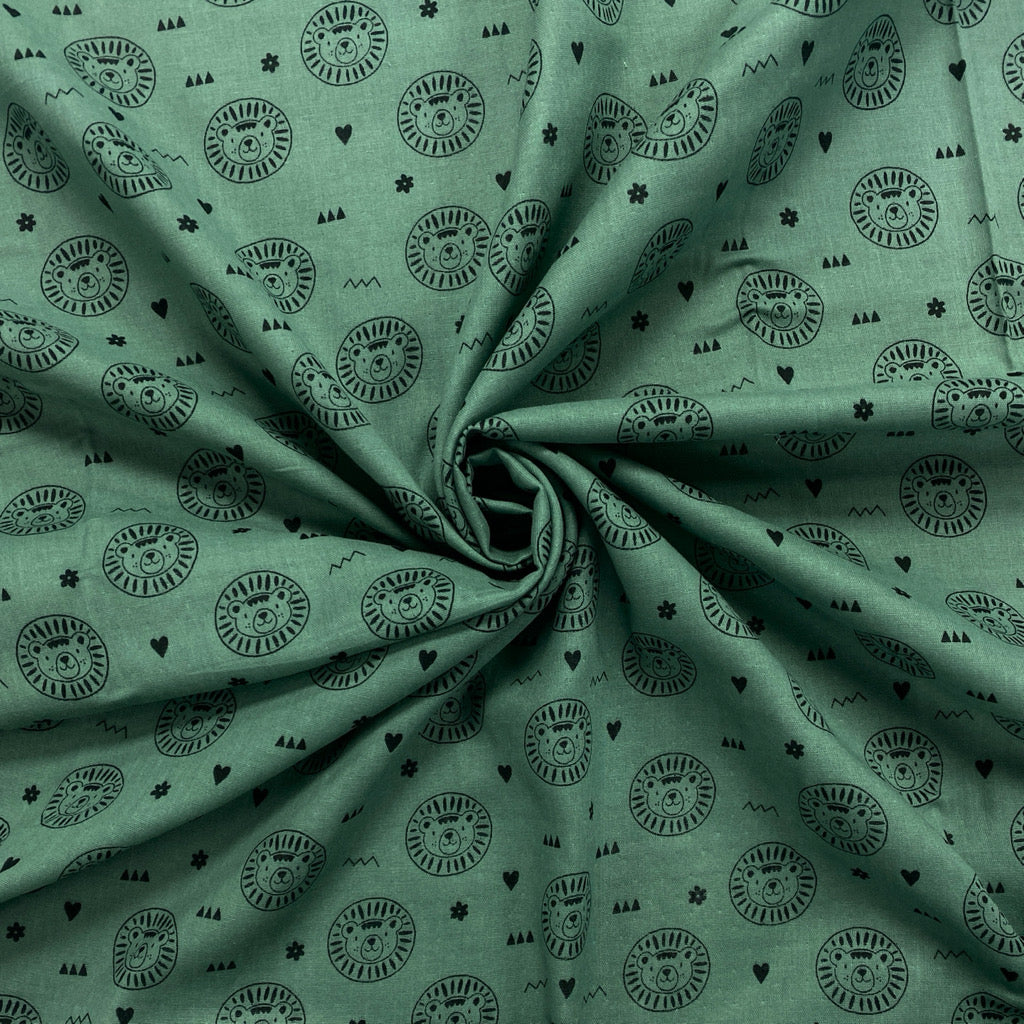 Lion Faces on Green Double Gauze Fabric - Pound Fabrics