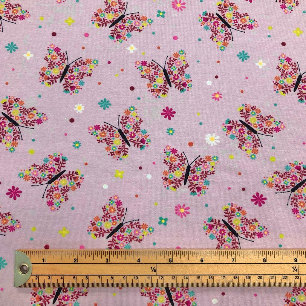 Floral Butterflies on Pink Cotton Jersey Fabric - Pound Fabrics