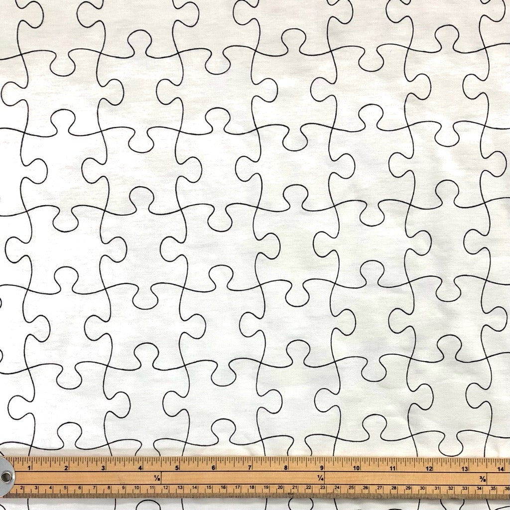 Jigsaw/Dinosaur Colour Changing Jersey Fabric - Pound Fabrics