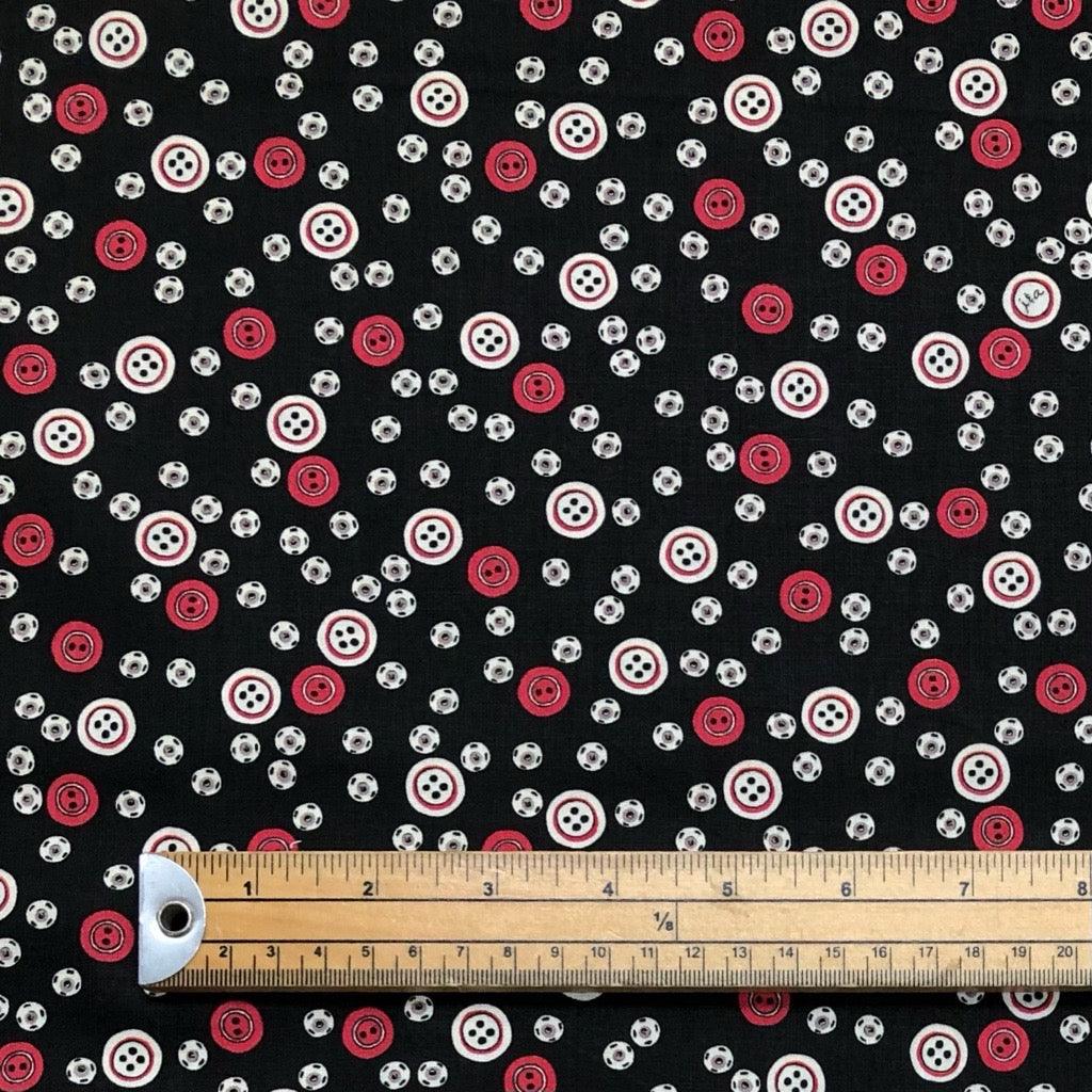 All Over Red and Beige Buttons on Black Cotton Fabric - Pound Fabrics