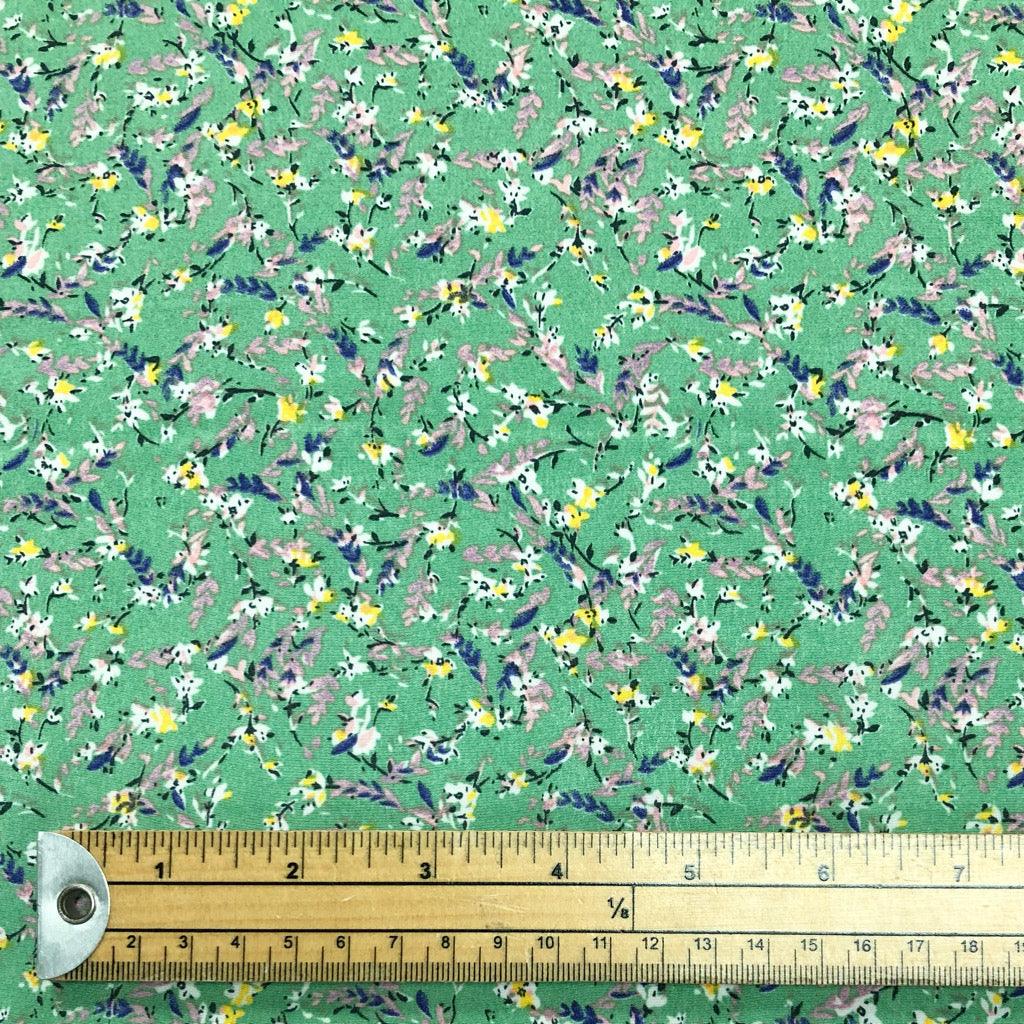 Mini Floral Bunch on Green Polyester Crepe Fabric - Pound Fabrics