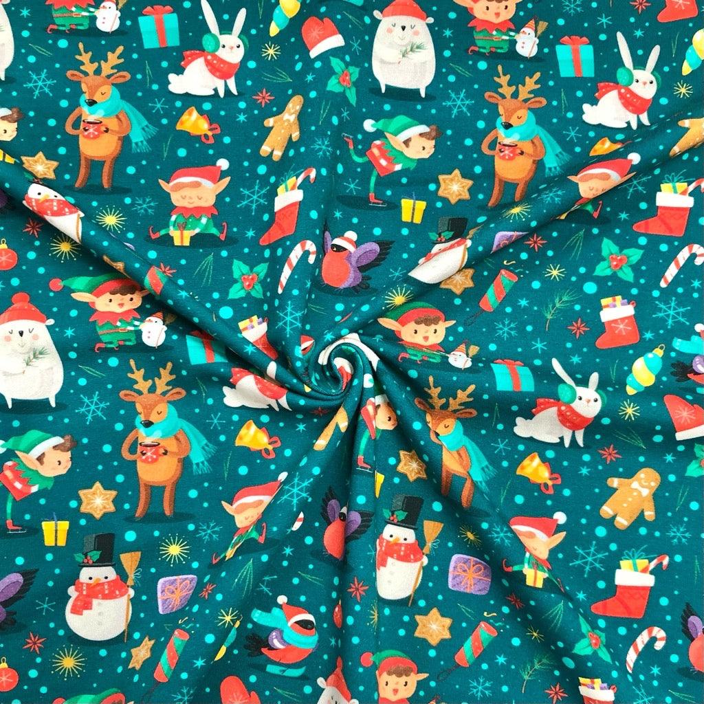 Christmas Motif on Teal French Terry Fabric - Pound Fabrics