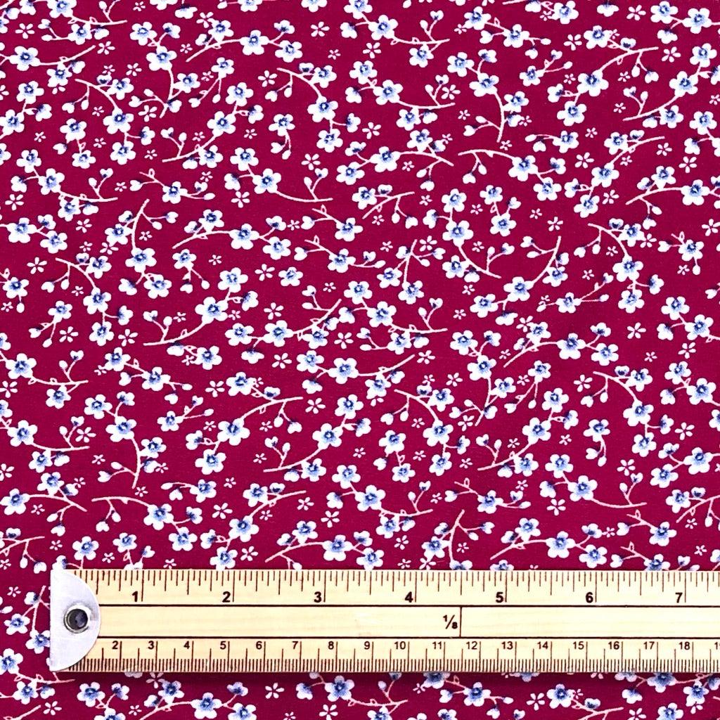 Tiny Blue Floral on Burgundy Viscose Challis Fabric - Pound Fabrics