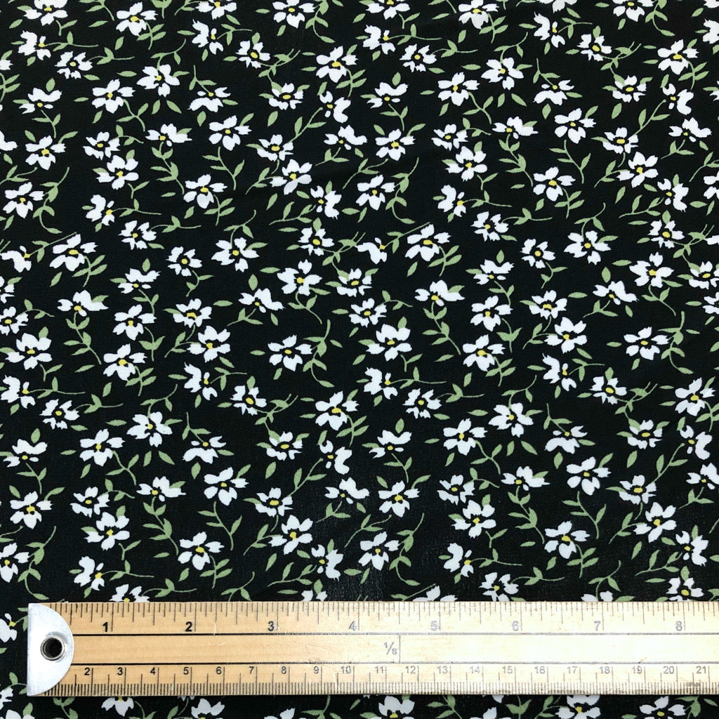 White Floral on Black Polyester Crepe Fabric - Pound Fabrics